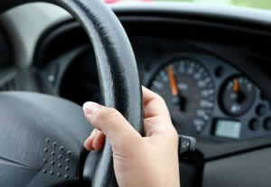 Holding steering wheel